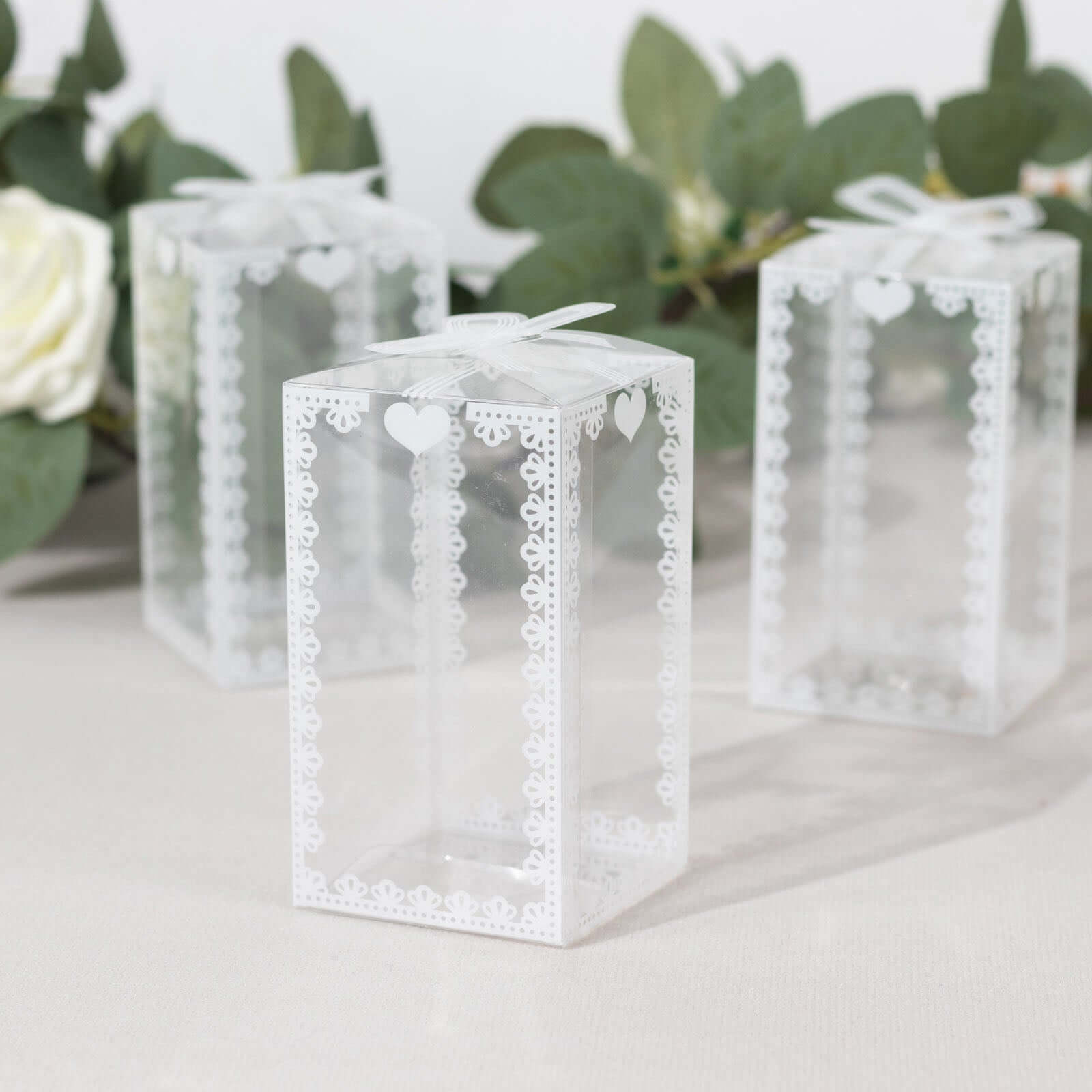 25 Pack Clear Rectangle Candy Gift Boxes With Bowknot and White Lace Pattern, 4" Transparent Plastic Party Favor Boxes - 2"x2"x4"