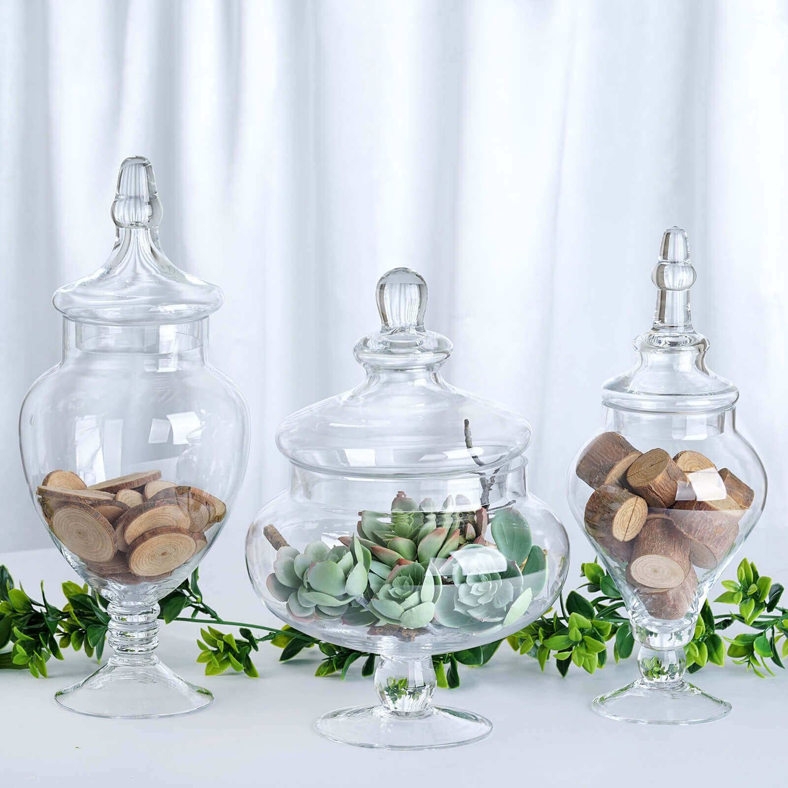 Set of 3 Glass Candy Jars Pedestal Apothecary Design Clear with Snap-On Lids - Stylish Party Favor Containers 10"/12"/14"